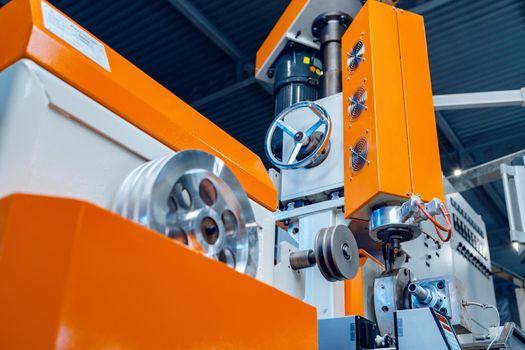Modern industrial plant. Automotive machine equipment parts close up. Factory background