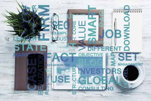 Top view of modern workplace with office stuff and business-related terms above presenting still office life
