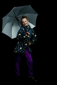 Beautiful little girl with umbrella. Concept of weather, climate change. Isolated