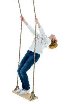 Beautiful young woman swinging fun on a swing. Concept summer vacation. Isolated on white background.