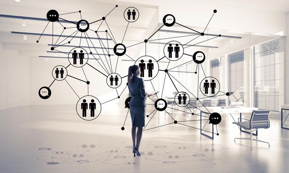 Elegant businesswoman in 3D office interior and social connection concept. Mixed media