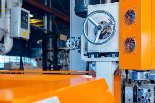 Modern industrial plant. Automotive machine equipment parts close up. Factory background
