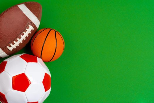 Set of balls for soccer, basketball and rugby. Close up.
