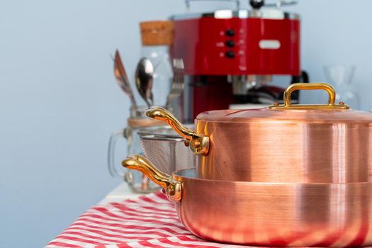 Clean cookware, utensils close up on table in modern kitchen. High quality photo