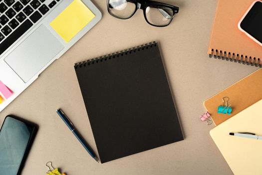 Open laptop with blank notebook, view from above. Workplace office concept