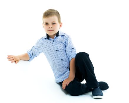 Cute little boy studio portrait on white cyclorama. The concept of a happy childhood. Isolated on white background