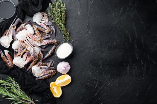 Fresh raw Blue Swimming Crab ocean gourme parts set, on black background, top view flat lay , with copyspace and space for text
