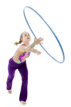 A girl gymnast performs an exercise with a hoop. The concept of gymnastics and fitness. Isolated on white background.