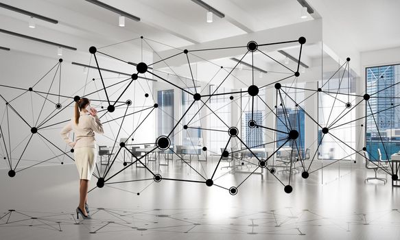 Elegant businesswoman in modern office interior and social connection concept. Mixed media