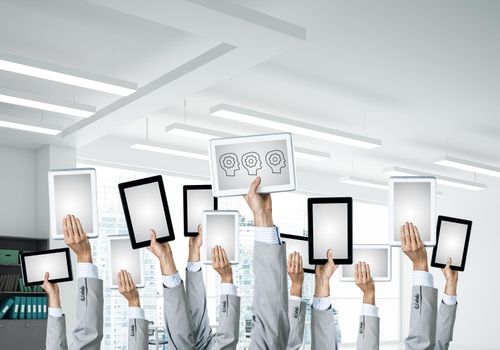 Set of tablets in male hands in modern office interior. 3d rendering