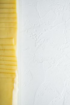 Slices of american cheese plastic pack, on white background with copy space for text
