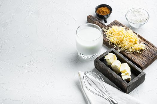 White Bechamel sauce ingredients set, on white stone background, with copy space for text