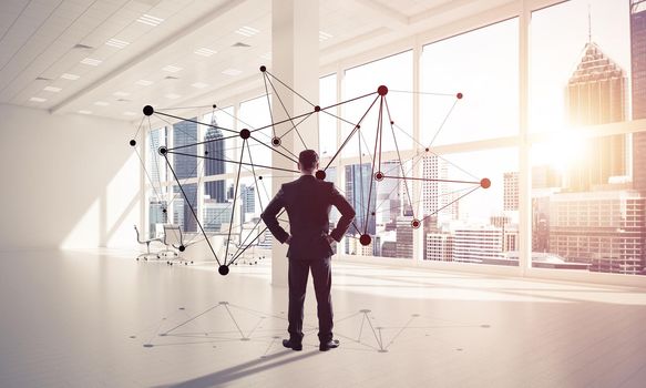 Elegant businessman in modern office interior and social connection concept. Mixed media