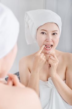 woman use dental floss white healthy with mirror in the bathroom