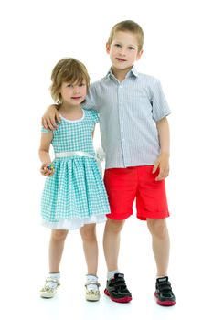 Boy and girl, brother and sister posing in the studio. Concept of family values, friendship, game. Isolated on white background