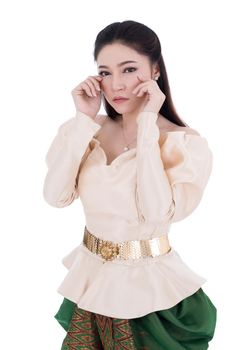 Depressed woman in Thai traditional dress isolated on white background