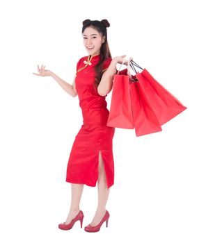 happy woman holding shopping bag on chinese new year celebration isolated on white background