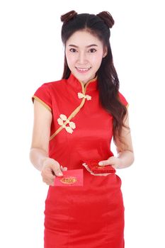 beautiful woman wearing cheongsam or qipao giving red envelopes in concept of happy chinese new year isolated on white background