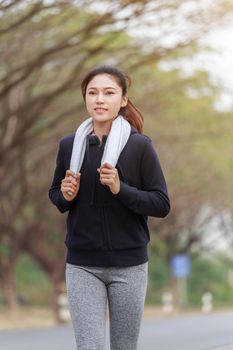 beautiful fitness woman running in the park