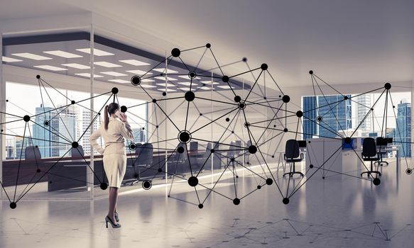 Elegant businesswoman in modern office interior and social connection concept. Mixed media