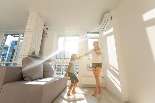 Happy loving family. Mother and her daughter child girl playing and dancing together