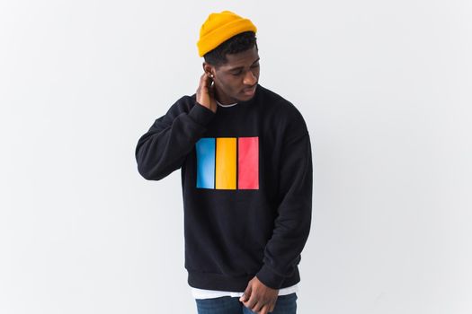 Youth fashion concept - Portrait of confident sexy black woman in stylish hoodie on white.