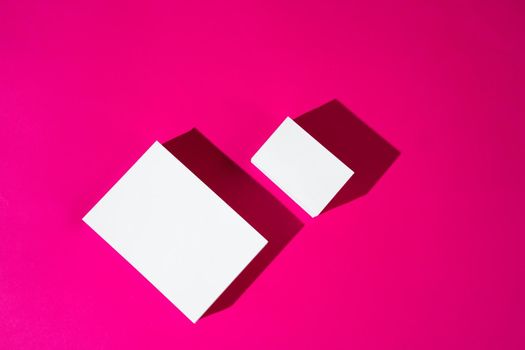 Mock-up on pink background. Businesscards with copy space close up