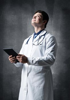 The doctor with the computer tablet. Digital technology in healthcare