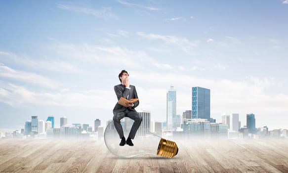 young businessman with a book. Concept of Creativity in Business