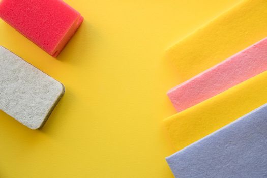 Pile of multicolored cleaning micro fiber cloth and cleaning sponges isolated on white background. Household concept.