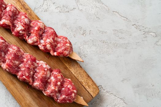 Raw turkish traditional meat kebab on the table. Close up.