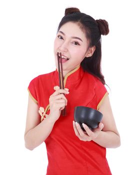 happy woman wearing chinese cheongsam dress with chopsticks and bowl isolated on a white background