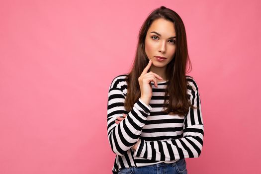 Closeup photo of amazing thoughtful beautiful young woman deep thinking creative female person holding arm on chin wearing stylish outfit isolated on colorful background with copy space.