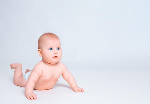 Cute baby girl on white background. Baby in diaper