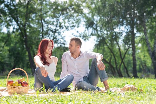 Couple at a picnic in the park. Spending time with a loved one