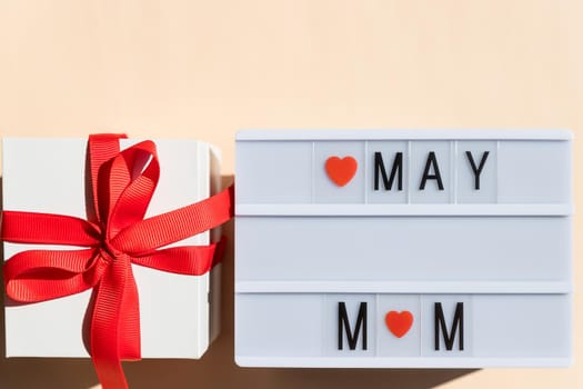 Lightbox with flowers and congratulation mothers day.