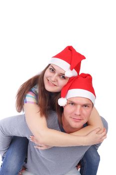 pretty young couple wearing Santa Claus caps