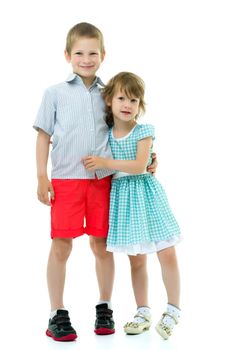 Boy and girl, brother and sister posing in the studio. Concept of family values, friendship, game. Isolated on white background