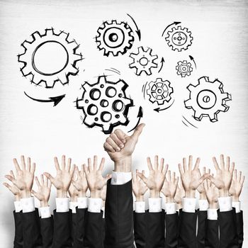 Group of hands of businesspeople showing gestures on wooden background