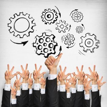 Group of hands of businesspeople showing gestures on wooden background