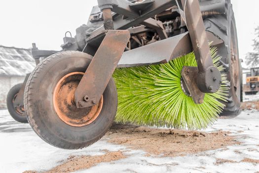 Sweeping machine tractor brush. Service and equipment for road and asphalt cleaning works.