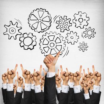 Group of hands of businesspeople showing gestures on wooden background