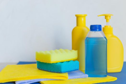 various cleaning products with sponge and towels