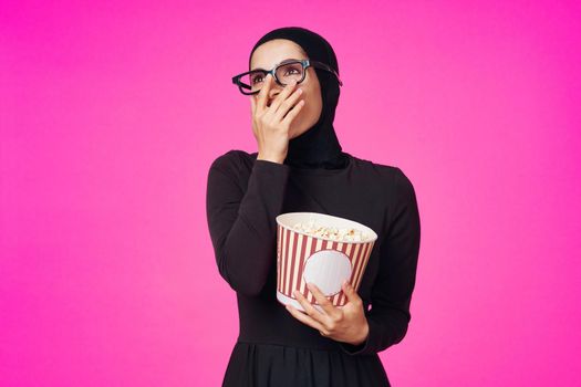 pretty woman attractive look popcorn glasses movie watching purple background. High quality photo