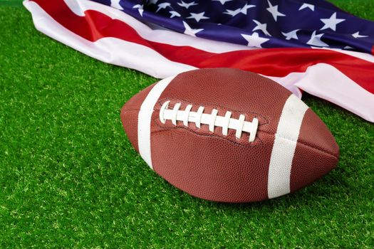 American game rugby ball on grass