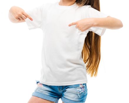 little girl in casual white T-shirt indicates at blank space for logo design