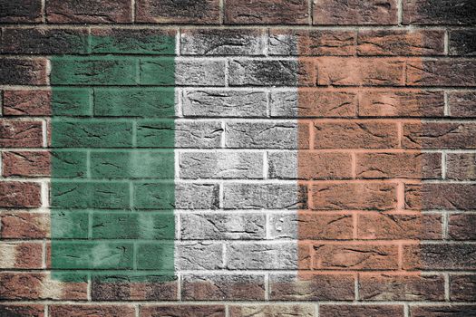 An Ireland flag painted on brick wall background