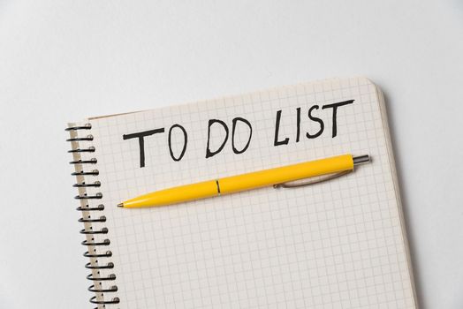 To do list. Notebook and colorful pen on white background. Handwritten, Top view.