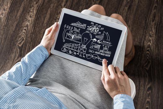 close-up, the business lady with the tablet. Concept of business planning