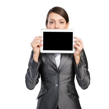 Businesswoman holding tablet computer with blank screen. Beautiful woman in business suit show tablet PC near her face. Corporate businessperson isolated on white background. Digital technology layout